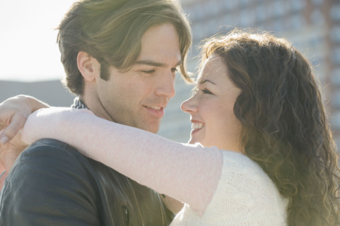 Close up of couple hugging.