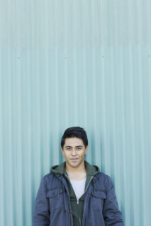 Man posing against wall. Date : 2008