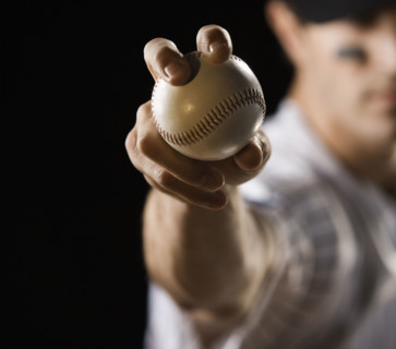 Close up of pitcher holding baseball. Date : 2008