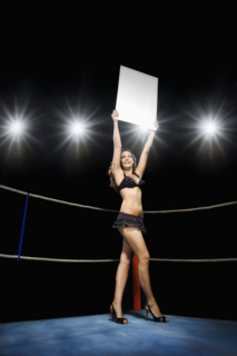 Ring girl holding sign in boxing ring. Date : 2008