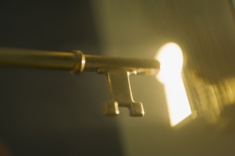 Close up of keyhole and key.