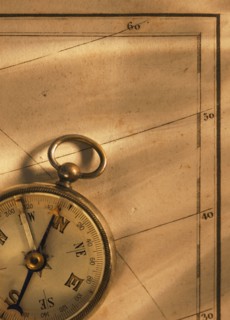 Close up of antique map and compass.