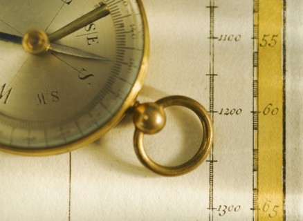 Close up of antique map and compass.