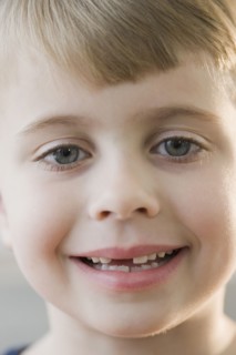 Portrait of boy with missing teeth.