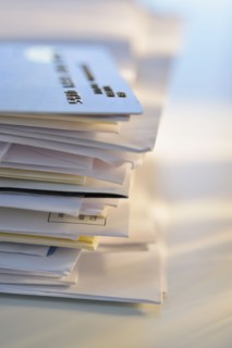 Credit card on stack of mail.