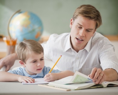 Teacher helping student with homework.