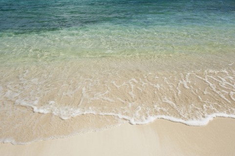 Beach and clear ocean water.