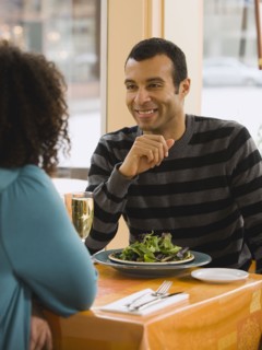 Couple eating in restaurant.