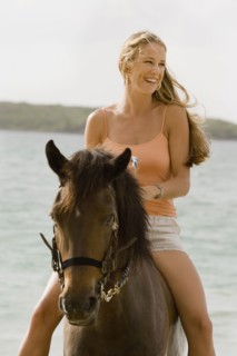 Woman horseback riding. Photographe : mark edward atkinson