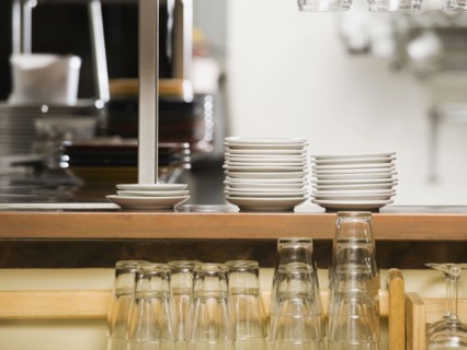 Clean dishes in restaurant.
