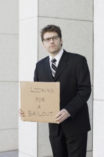 Businessman begging for money. Photographe : PT Images