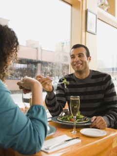 Couple eating in restaurant.