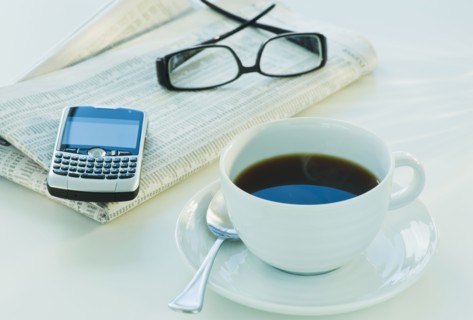 Cup of coffee and business tools. Photographe : Daniel Grill