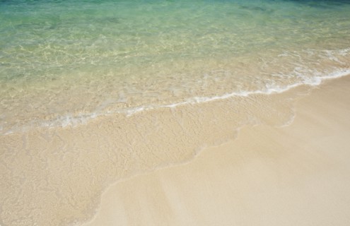 Beach and clear ocean water.