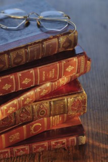 Antique books and eyeglasses.
