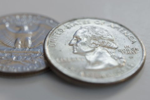 Close up of silver coins.