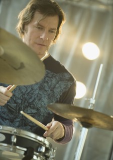 Man playing drums.
