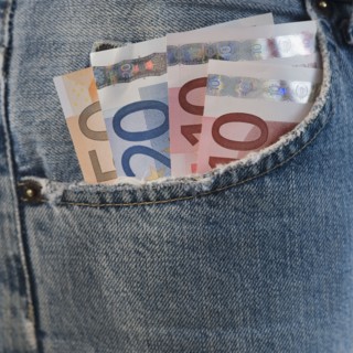 Assorted euro notes in pocket.