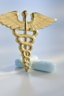 Prescription medicine and caduceus.