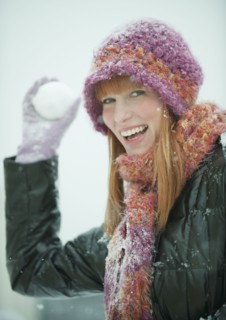 Woman throwing snowball.