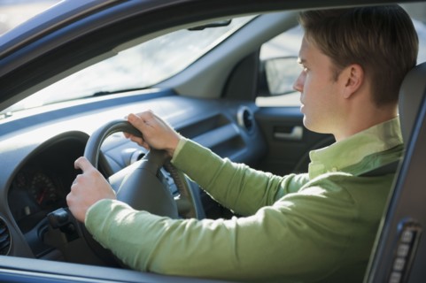 Man driving car.