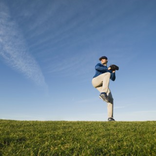 Baseball player throwing ball.