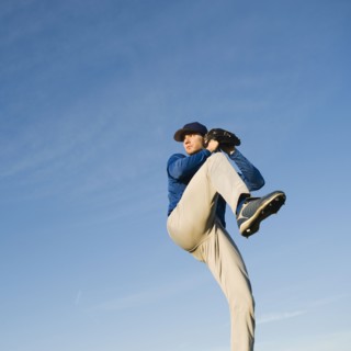 Baseball player throwing ball.