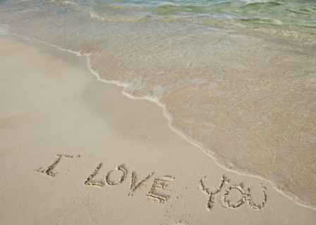 I love you message written in sand.