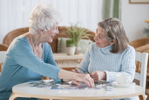 Senior women assembling puzzle.