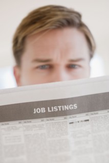 Man reading job listings.