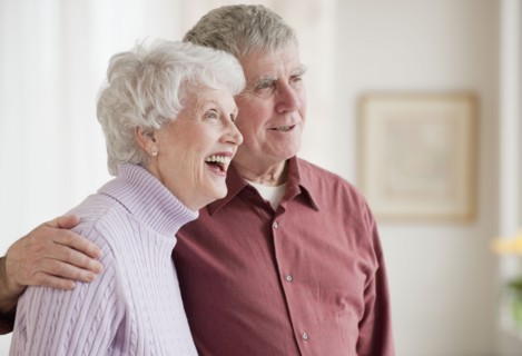 Senior couple hugging.