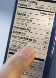 Man reading nutrition information.