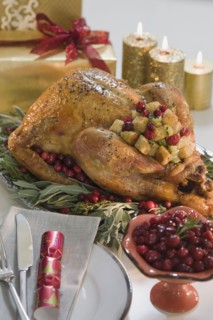 Thanksgiving turkey on decorated platter.