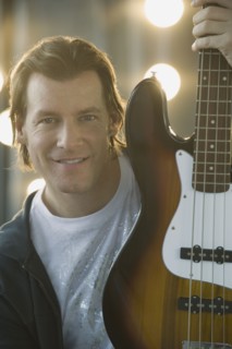 Man holding electric guitar.