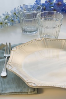Tropical flowers and placesetting.