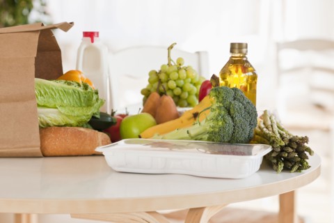Paper bag filled with groceries.