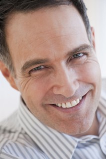 Portrait of successful mature businessman smiling.