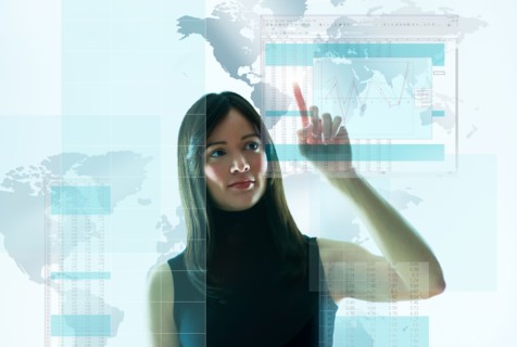 Mid-adult woman pointing on world map.