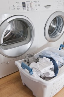 Laundry in basket in launderette.
