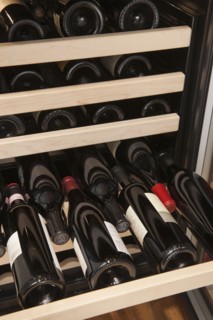 Wine bottles in wine cooler.