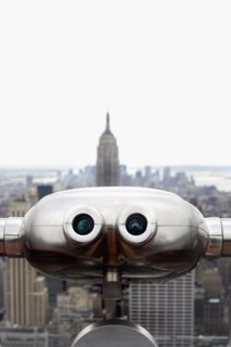 Coin operated binoculars pointing at Empire State Building, New York City, New York, USA.
