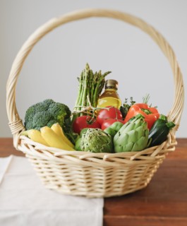 Wicker basket filled with vegetables.
