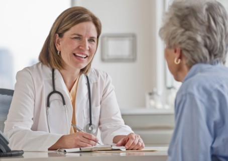 Senior woman talking with female doctor.