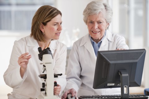 Two female scientists doing research.