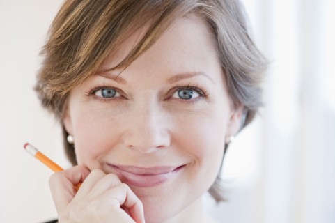 Portrait of successful mature businesswoman, smiling.