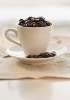 Coffee beans in cup.