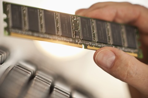 Hand holding computer chips.