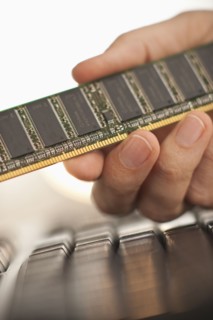 Hand holding computer chips.