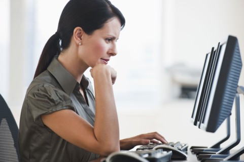 A businesswoman using a computer.