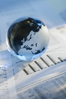 A globe on business papers.